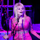 NASHVILLE, TENNESSEE - OCTOBER 24: Dolly Parton performs at the 2021 Kiss Breast Cancer Goodbye Concert at CMA Theater at the Country Music Hall of Fame and Museum on October 24, 2021 in Nashville, Tennessee. (Photo by Jason Kempin/Getty Images)